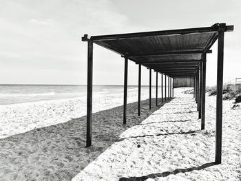 Geometric sunshade at sea beach, minimalistic marine view