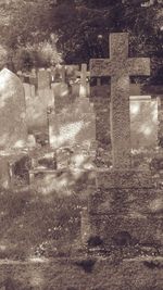 Stone wall in cemetery against building