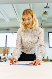 Young woman working at home