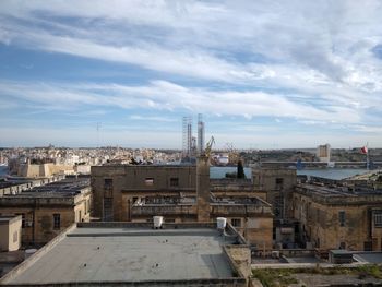 High angle view of buildings in city against sky