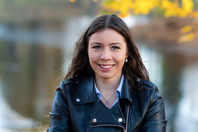 Portrait of smiling young woman outdoors