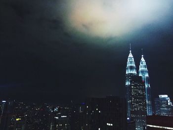 View of skyscrapers lit up at night