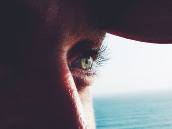 Close-up of woman looking at sea