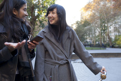 Young women checking their smart phones