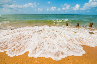 Scenic view of beach against sky