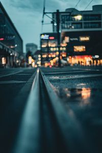 Illuminated city street at night