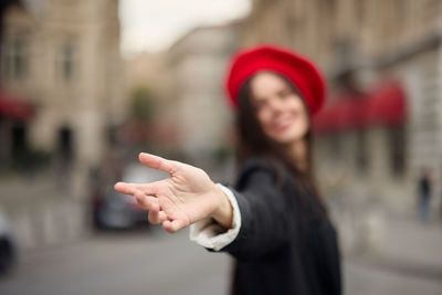 Portrait of young businesswoman standing outdoors