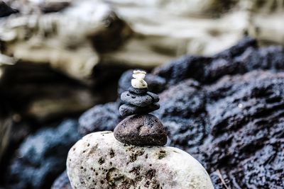 Close-up of stone stack on rock