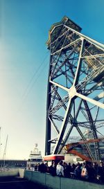 Low angle view of ferris wheel against sky