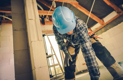 Low section of man working at construction site