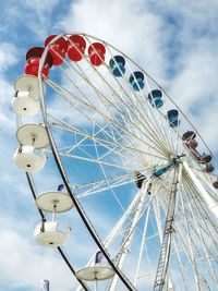 Low angle view of ferris wheel against sky