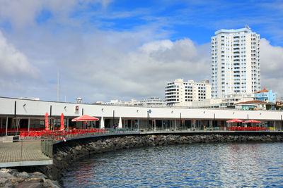 View of bridge in city against sky