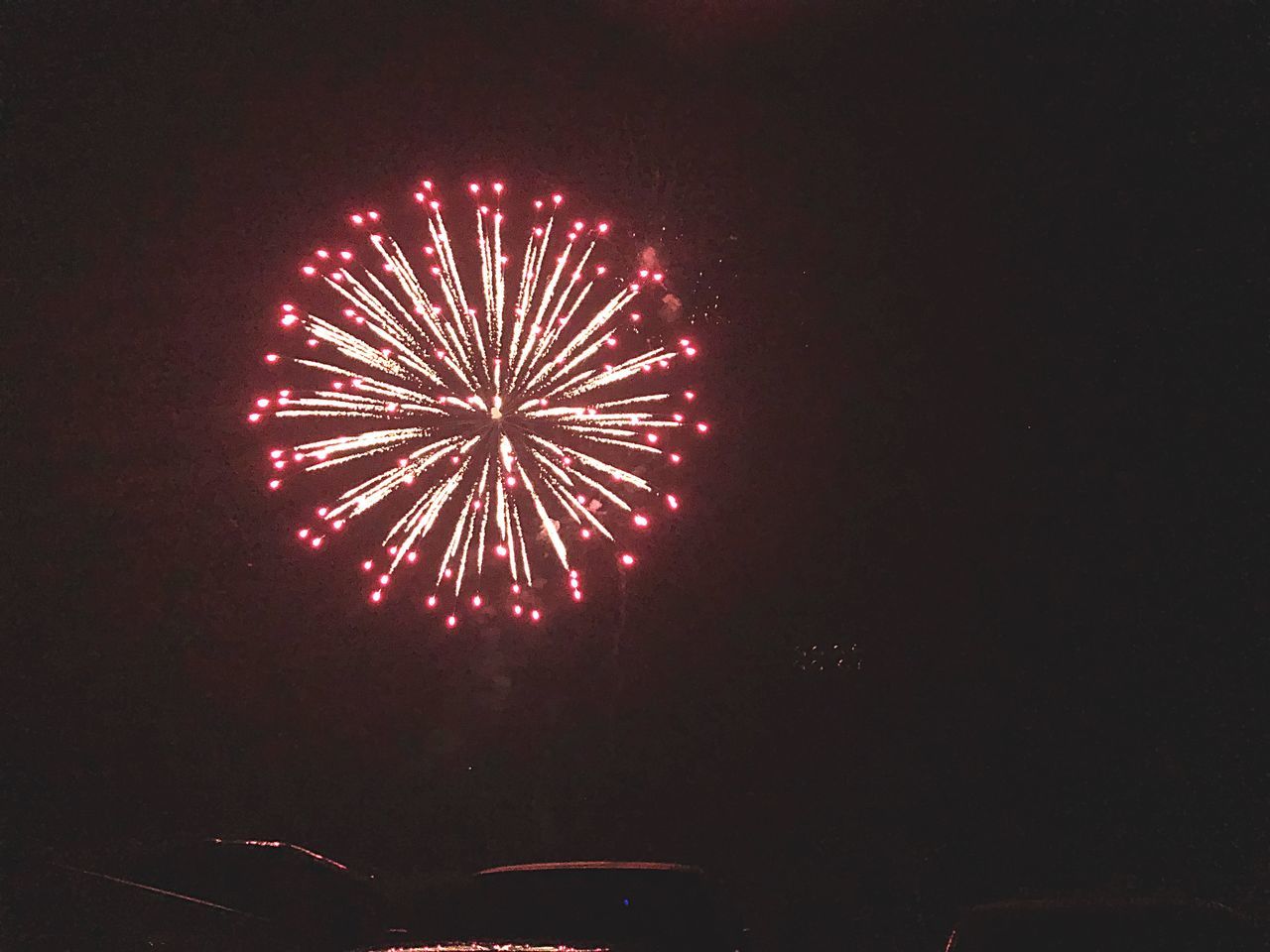 night, celebration, arts culture and entertainment, illuminated, firework, firework display, event, motion, exploding, long exposure, glowing, low angle view, firework - man made object, light, sky, sparks, no people, red, blurred motion, nature, entertainment event, explosive