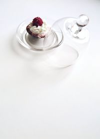 High angle view of cupcake served in glass bowl on table