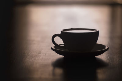 Close-up of coffee cup on table