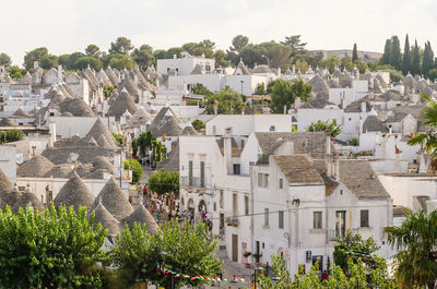 Buildings in town against sky