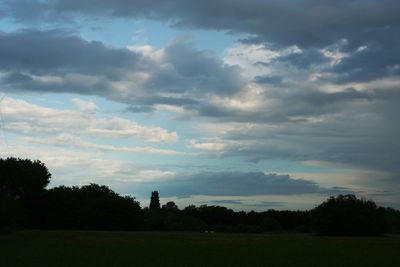 Scenic view of field against sky during sunset