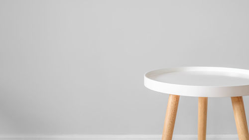 Close-up of empty bowl on table against white background