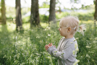 Smiling girl on meadow