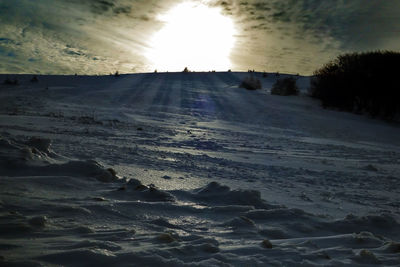 Scenic view of snow covered landscape against sky