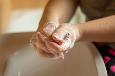Close-up of woman hand holding ice cream