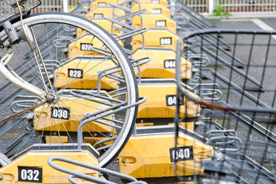 Close-up of yellow bicycle wheel