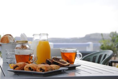 Breakfast served on table against clear sky