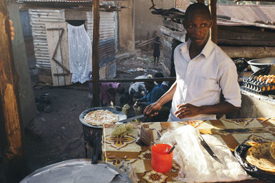 Man working on tray