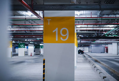 Road sign on railroad station platform