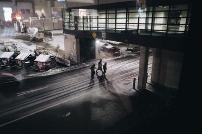 Man walking in illuminated corridor