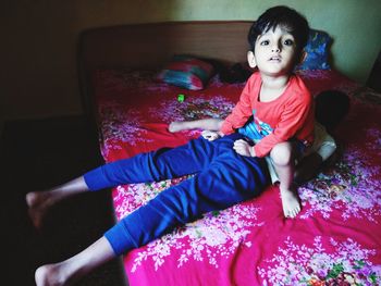 High angle view of girl sitting at home