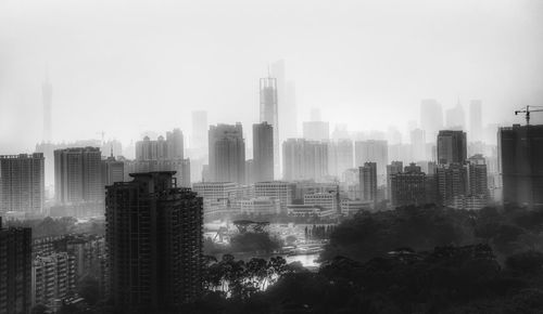 Skyscrapers in city against sky