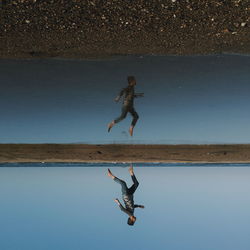 Low angle view of a woman jumping