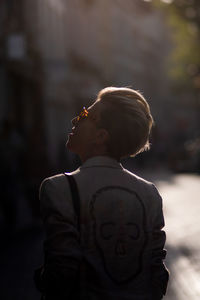 Portrait of boy looking away outdoors