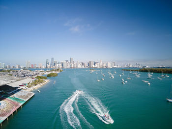 Panoramic view of sea and buildings against sky