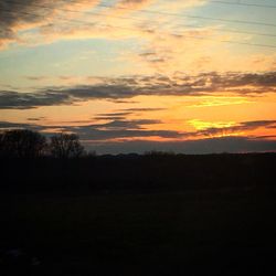 Scenic view of landscape against sky during sunset