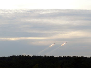 Scenic view of vapor trails in sky