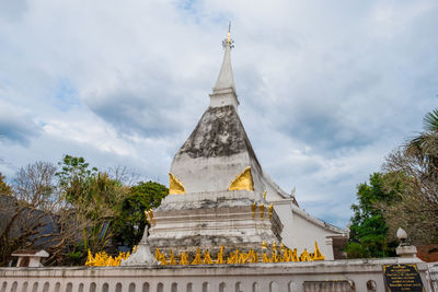 View of temple building against cloudy sky