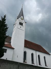 Low angle view of bell tower against sky