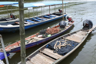 High angle view of boats moored at harbor