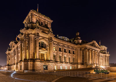 Buildings in city at night