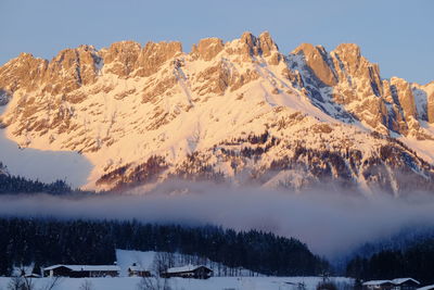 Scenic view of snow covered mountains against sky