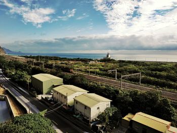 High angle view of trees by sea against sky