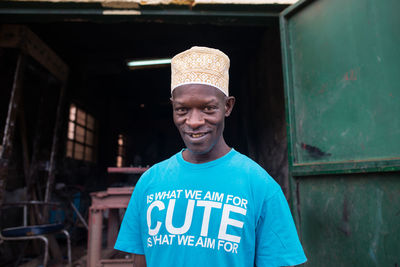 Portrait of a smiling young man standing outdoors