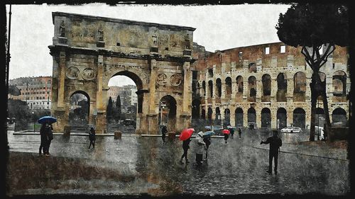 People in front of historic building