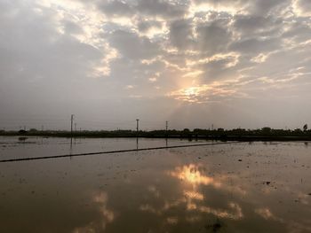 Scenic view of lake against sky during sunset