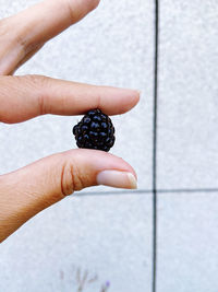 Midsection of person holding fruit