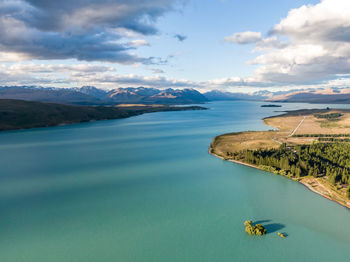 Drone view of lake tekapo on new zealand's south island. southern alps in the background.