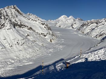 Scenic view of snowcapped mountain against sky