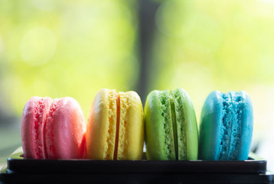 Close-up of multi colored macaroons on table